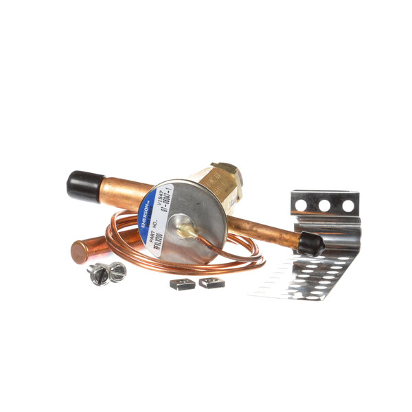A copper capillary tube and Randell RF VLV200 expansion valve with other tools.
