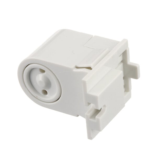 A close-up of a white plastic True Refrigeration lamp holder with a hole.