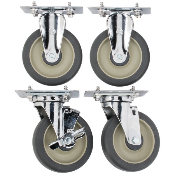 A set of four Cambro casters with rubber wheels, two with black and two with chrome wheels.
