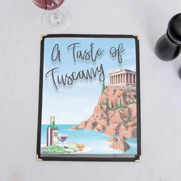 A white table with a menu cover featuring a Mediterranean Parthenon design and a wine bottle.