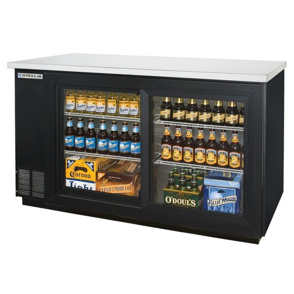 A black Beverage-Air wine refrigerator on a counter full of bottles of beer.
