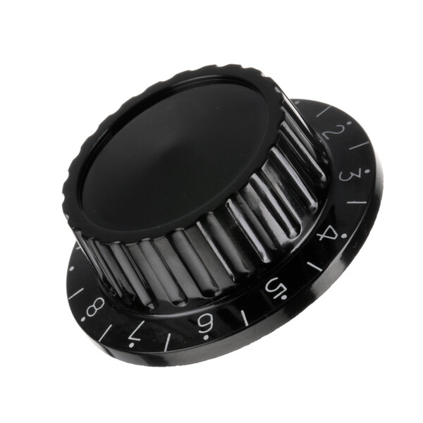 A black Duke heater control knob with numbers.