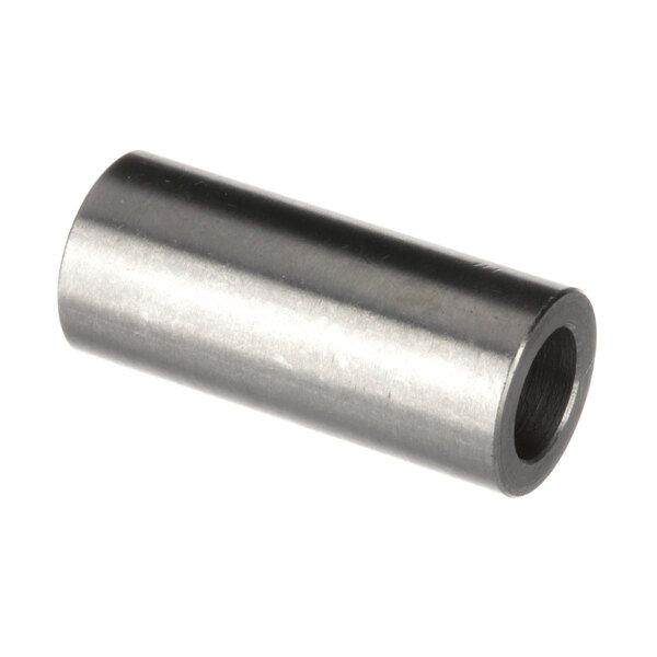 A close-up of a stainless steel metal cylinder with a hole in it.