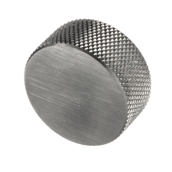 A stainless steel Henny Penny knob with a patterned surface.