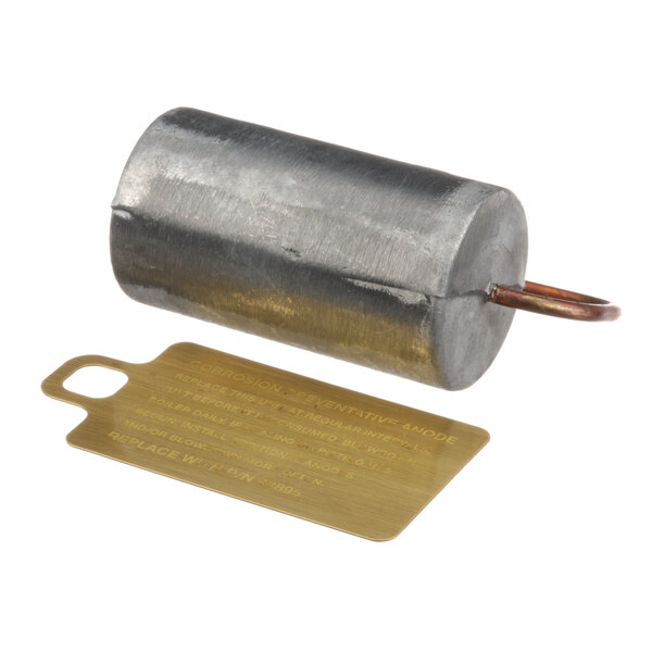 A round metal Cleveland anode with a gold tag.