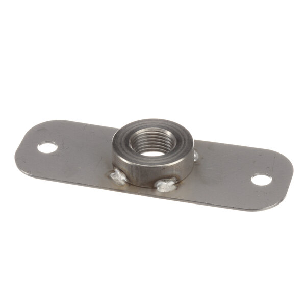 A metal plate with a nut attached.
