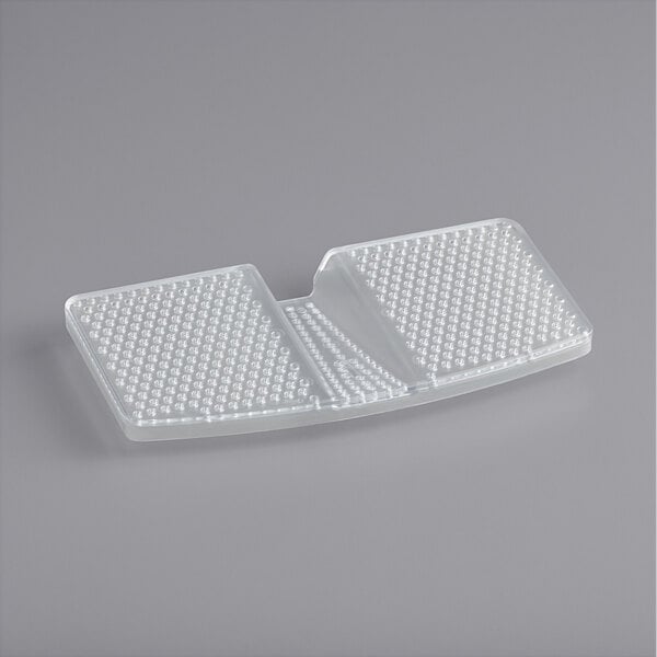 A white plastic tray with small holes and a clear plastic pad with holes.