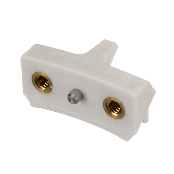 A white plastic Hobart V1401 I fixed shoe kit connector with gold and silver screws.