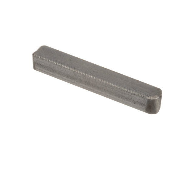 A rectangular metal bar with a small hole in it.