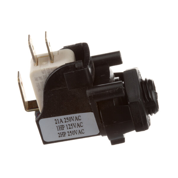 A close-up of a black and white Antunes air switch with a small wire.