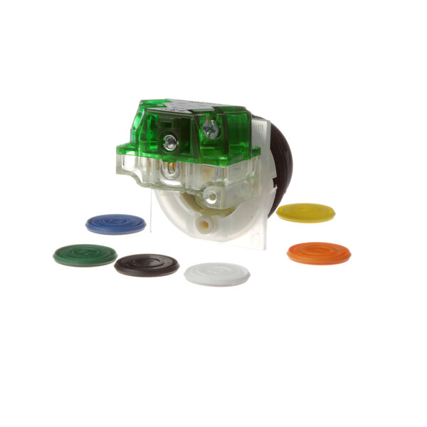 A close-up of a green and white Power Soak mechanical button with colored circles.
