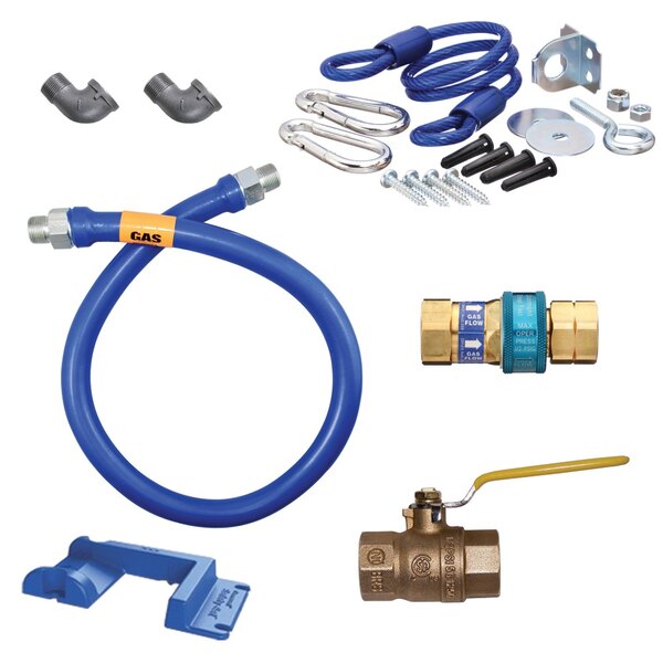 A blue Dormont gas connector kit with other tools and hardware.