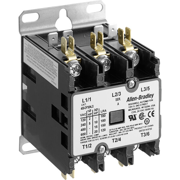 An Accutemp 24v contactor with a black and white electrical device.