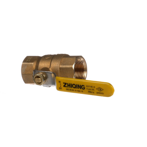 A brass ball valve with a yellow handle.