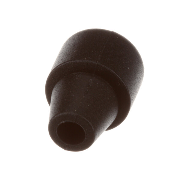 A close-up of a black rubber spacer with a hole.