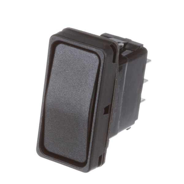 A close-up of a black Giles rocker switch with a rectangular black cover.