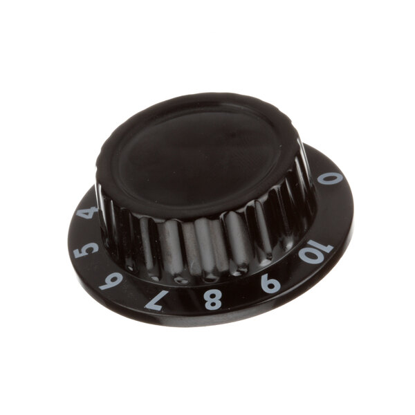 A close-up of a black APW Wyott knob with numbers.