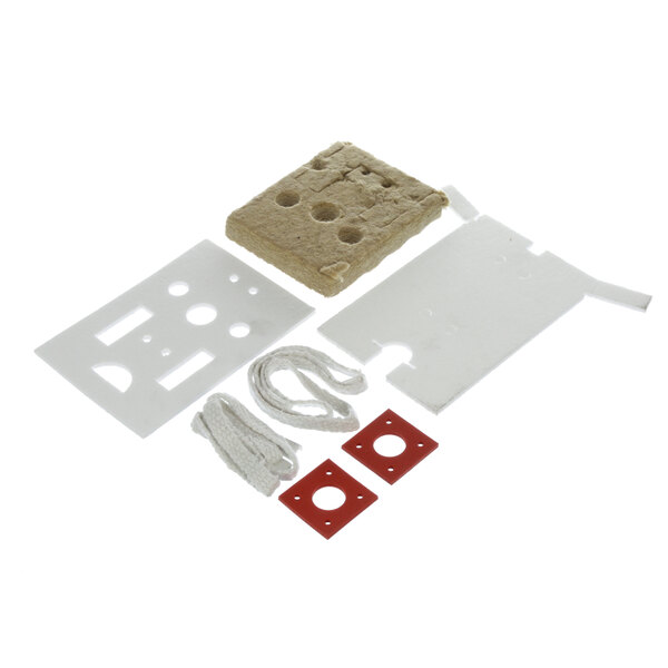 A white and red plastic kit with rectangular and red square pieces.
