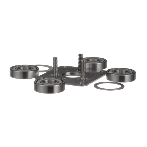 An Antunes ball bearing kit with metal bearings and bearing rings on a metal plate.