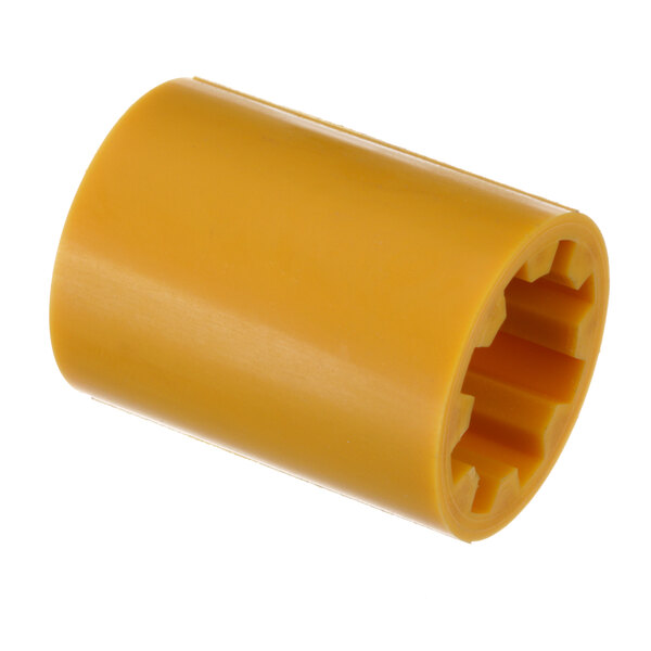 A yellow plastic cylinder with a hexagon cut out.
