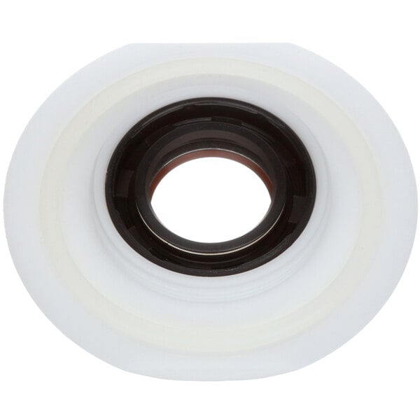 A white and black rubber bowl seal with a black circle on a white tape.
