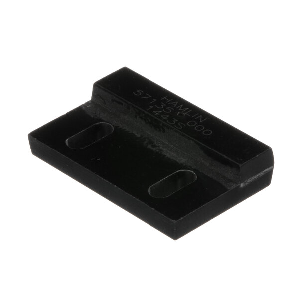 A black rectangular plastic object with two holes.