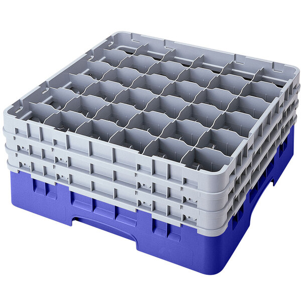 A stack of blue plastic Cambro glass racks with extenders.