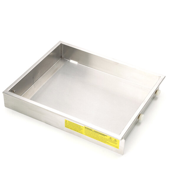 A stainless steel Cleveland drain pan with a yellow label on it.