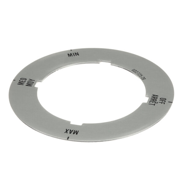 A circular metal Garland dial insert with black text reading "Off/Min/Med/Max" on it.