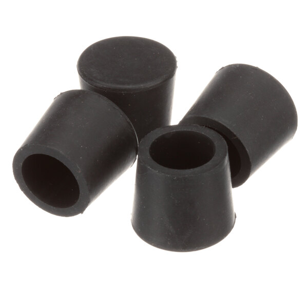 A group of black rubber feet for Antunes griddles.