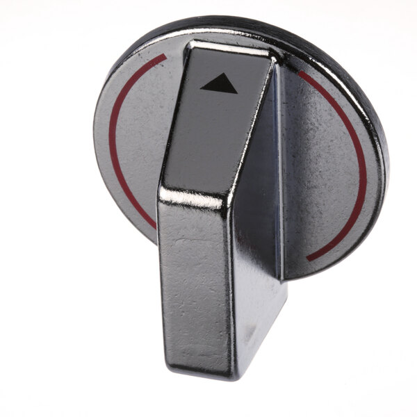 A close-up of a silver metal rectangular knob with a black and red circle.