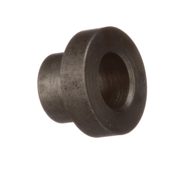 A close-up of a round metal Edlund bushing with a hole in it.