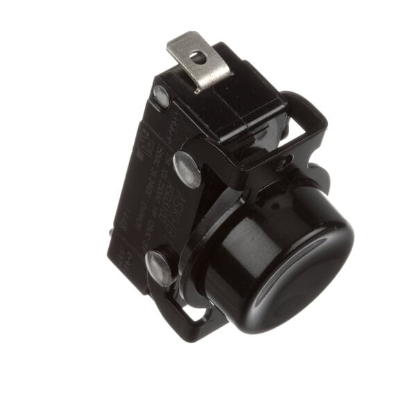 A black plastic Antunes round push button switch with a metal clip.