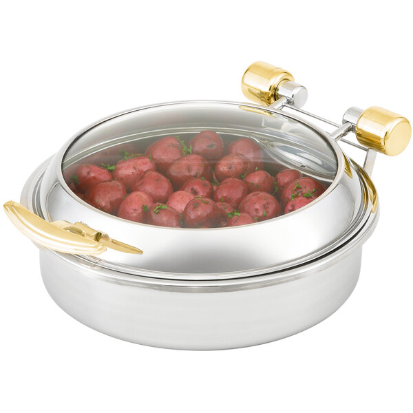 A Vollrath stainless steel chafing dish with a glass lid filled with red potatoes.