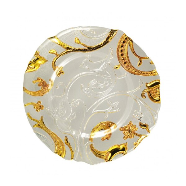 A close-up of a 10 Strawberry Street Giardino Nouve glass charger plate with gold and white designs.