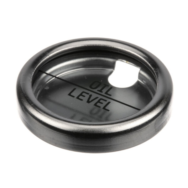 A black metal round with the word "level" on it.