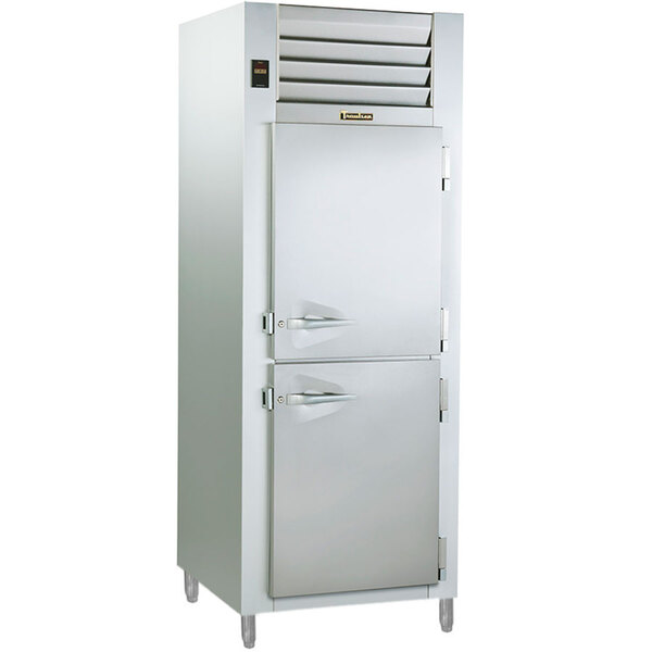 A Traulsen white refrigerator holding cabinet with a half door and vent.