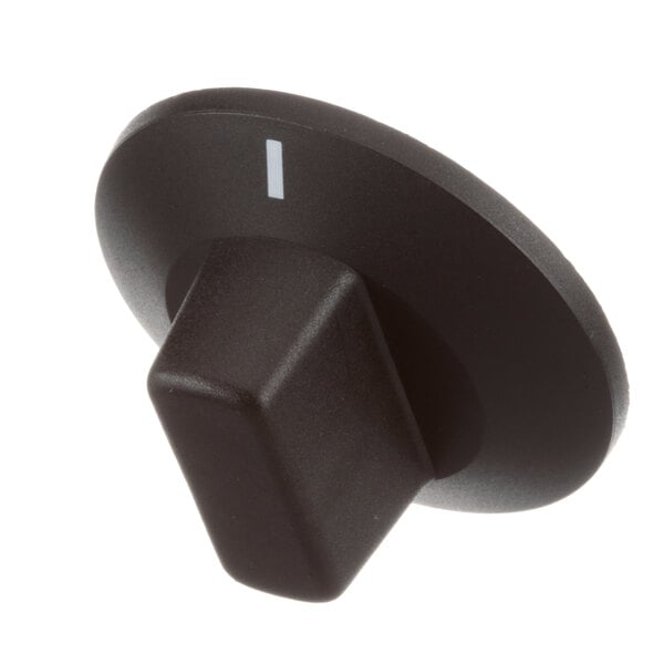 A black plastic Moffat knob with a white button on it.