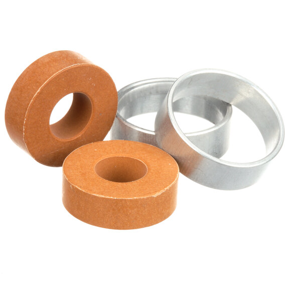 A close-up of three different brown rubber rings.