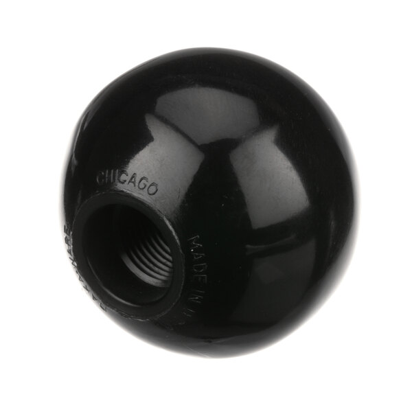 A black round knob with a nut on it.