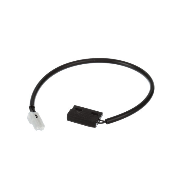 A black wire with a white connector on a black rectangular object with white text.