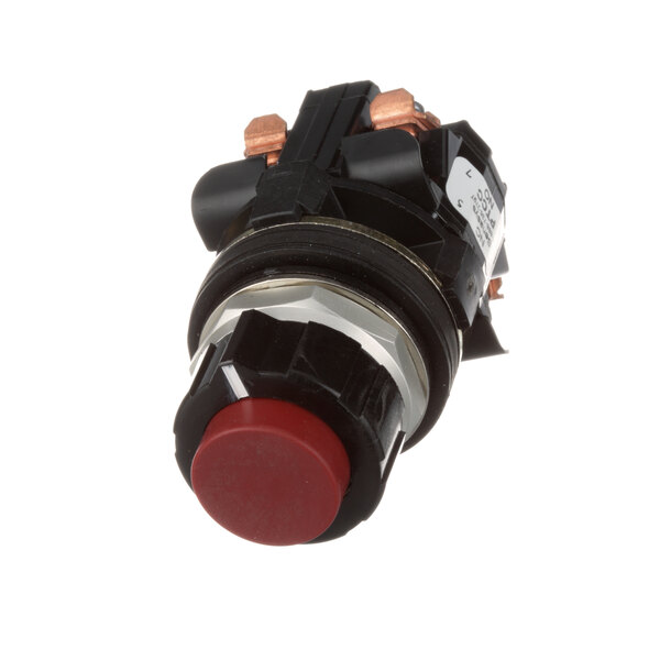 A close-up of a Groen round push button switch with a red button and black housing.