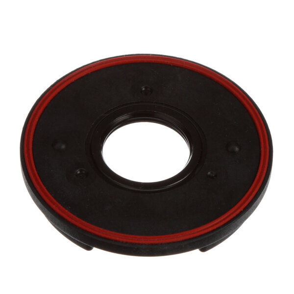 A black Vitamix retainer nut with a white and red rubber circle