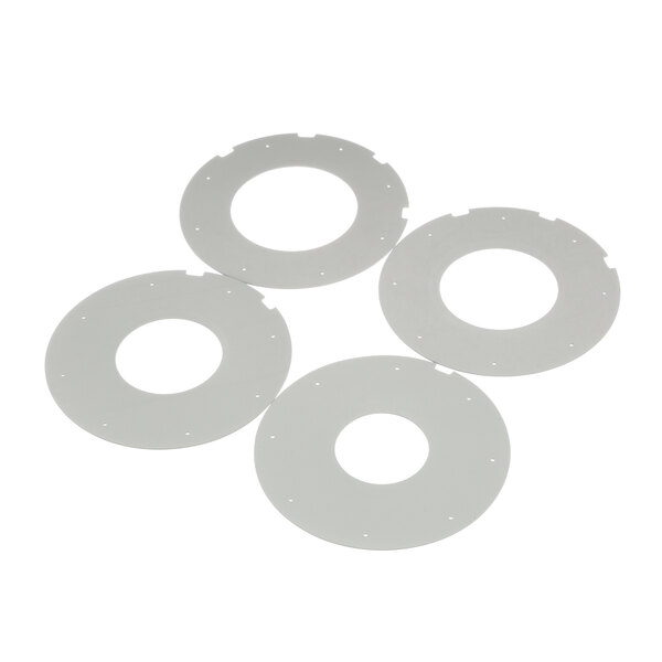 Four white plastic circular plates with holes in the middle.
