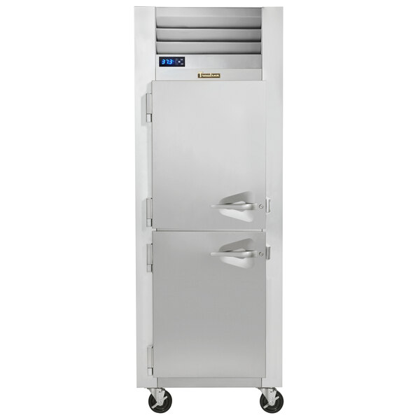 A Traulsen reach-in refrigerator with left hinged doors.
