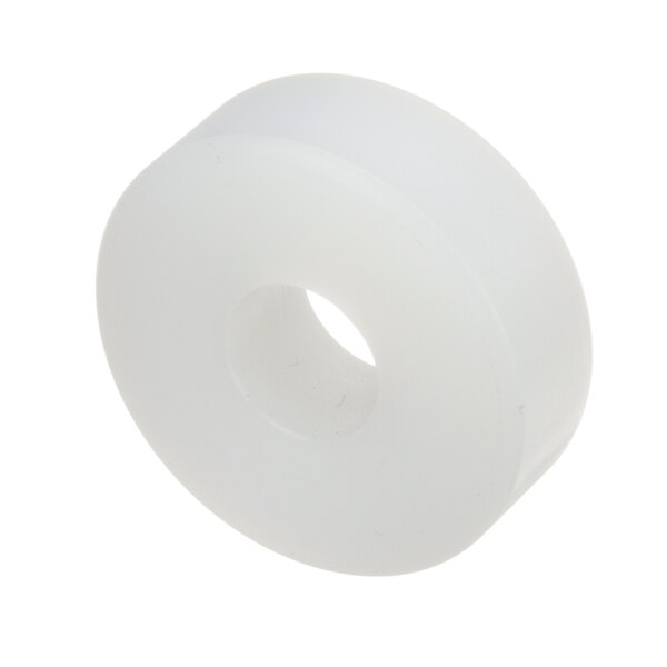 A white plastic wheel with a hole in it.