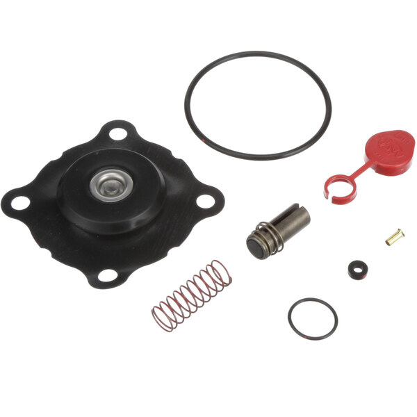 A Stero 0P-542842 repair kit with black and silver gaskets and a red plastic object with a circle on the end.