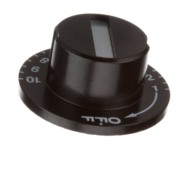 A black Metro thermostat knob with white text that says "out" on it.