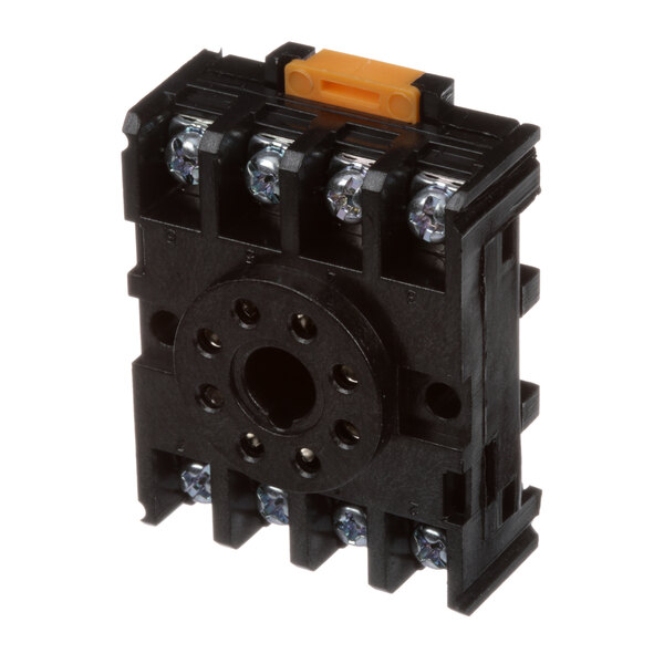 A black square electrical device with many small metal parts.
