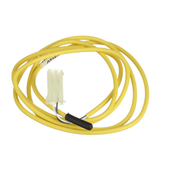 A close-up of a yellow wire with a black connector on a Traulsen Sensor/Discharge.